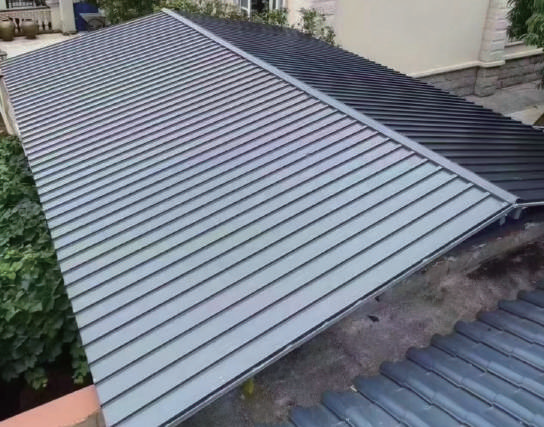Profiled sunroom roof with a ridge junction and perimeter trim connections