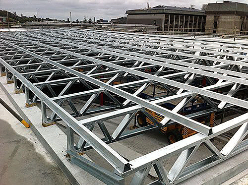 Repeated steel members and joints in a mounting framework