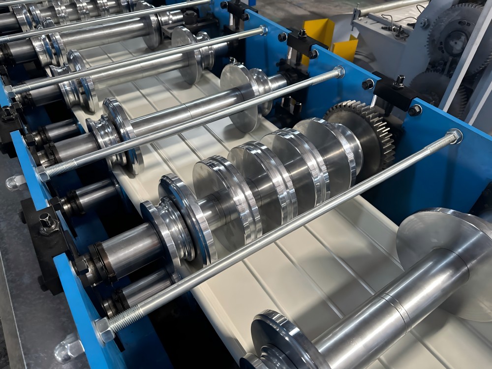 Close view of forming rollers and metal strip on the BMS roof-panel line